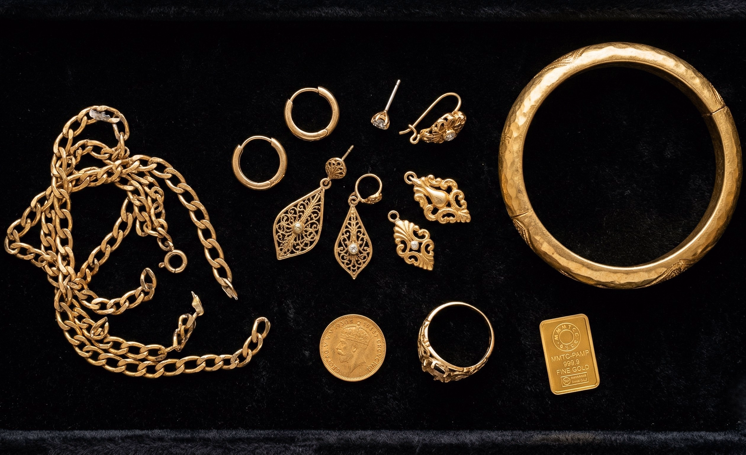 Assorted gold items including jewelry, coins, and bars
